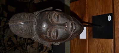 Lot 1199 - A Punu Dark Stained Wood Mask, 53cm high