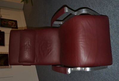 Lot 1200 - A Stainless Steel and Burgundy Leather Reclining Armchair, designed by F A Porsche, IP845, with...