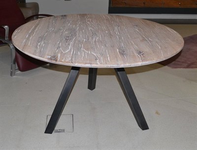 Lot 1209 - An Oliver B Limed Oak Circular Dining Table, of recent date, raised on a triform metal base,...