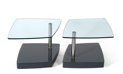 Lot 1216 - A Pair of Rolf Benz Glass Top Two-Tier Lamp Tables, of rounded square form, with a stainless...