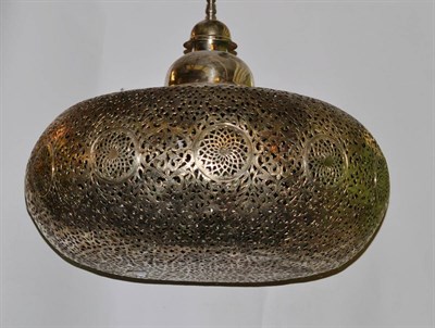 Lot 1225 - A Pierced White Metal Pendant Light in the Moroccan Taste, approximately 50cm drop (excluding...