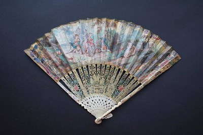 Lot 255 - An Early 18th Century Ivory Fan, with a pastoral scene of two couples, two children and a governess