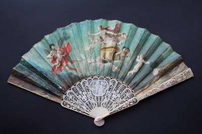 Lot 280 - Eros and Anteros: A Mid-18th Century Ivory Fan, the sticks intricately carved and pierced, the...