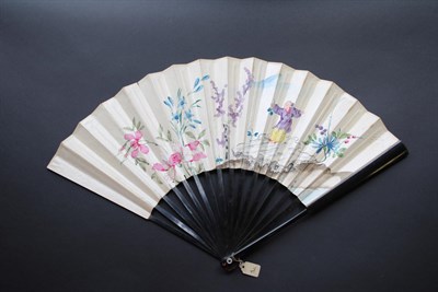 Lot 294 - An 18th Century Fan, of plain wood, painted dark brown/black, the double paper leaf quite...