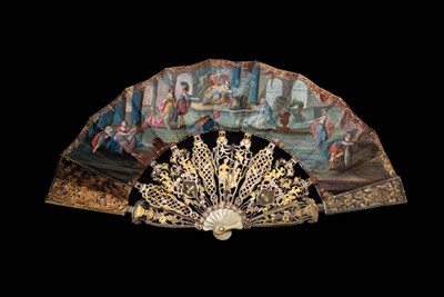 Lot 322 - Anthony and Cleopatra: An 18th Century Ivory Fan, with extravagant monture, the heavy sticks carved