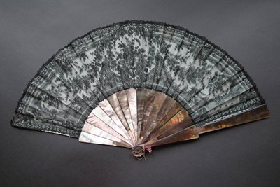 Lot 340 - A Circa 1880's Black Lace Fan, Chantilly, mounted on dusky dark grey/mauve mother-of-pearl...