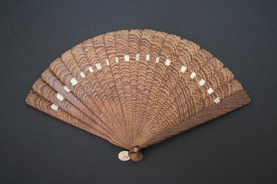 Lot 354 - An  Early 19th Century Wooden Brisé Fan, cut to make the very most of a distinctive grain,...