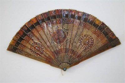 Lot 357 - An Early 19th Century Tortoiseshell Brisé Fan, painted with gold, three differently shaped...