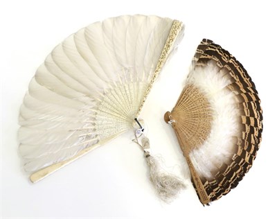 Lot 378 - A Chinese Carved Ivory Feather Fan, Qing Dynasty, the heavily carved guards deeply and...