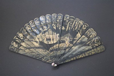 Lot 384 - A 19th Century Chinese Wooden Brisé Fan, Qing Dynasty, the black lacquer painted in gold. The...