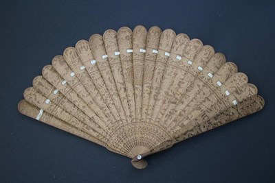 Lot 385 - A Circa 1840 Chinese Carved Sandalwood Brisé Fan, Qing Dynasty, a central oval carved with...