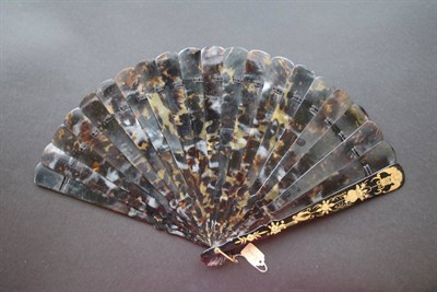 Lot 393 - A Circa 1860's Chinese Tortoiseshell Brisé Fan, Qing Dynasty, with gold paintings to both...