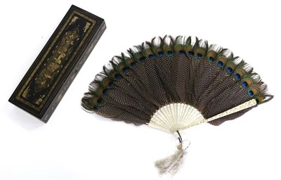 Lot 405 - A 19th Century Chinese Carved Ivory Peacock Feather Fan, Qing Dynasty, the gorge sticks lightly...