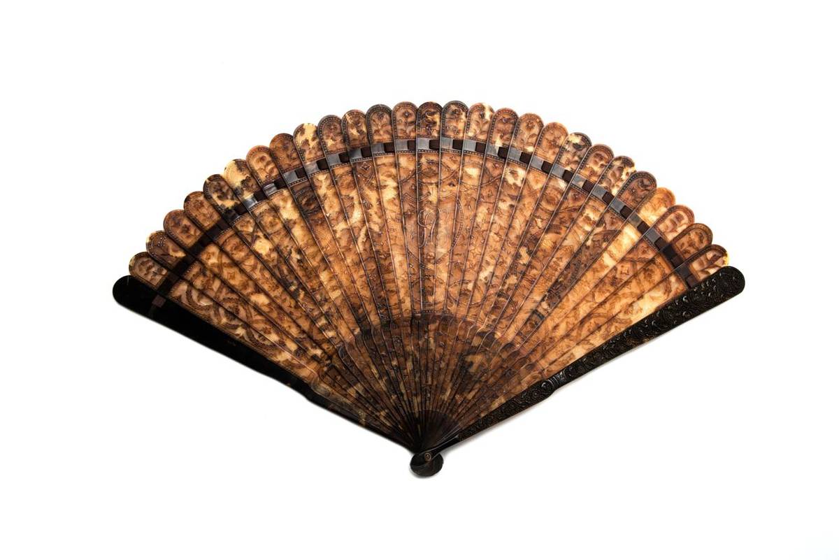 Lot 409 - A Fine and Early Chinese Carved Tortoiseshell Brisé Fan, Qing Dynasty, circa 1790, well carved...
