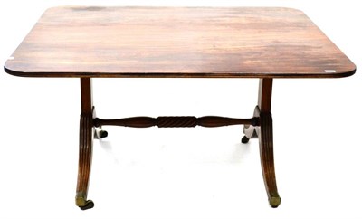 Lot 1035 - A George III Mahogany Fliptop Dining Table, 18th century and adapted, of rounded rectangular...