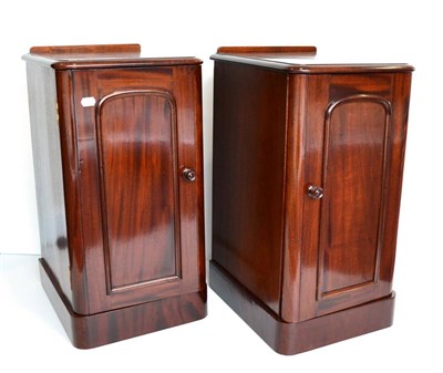 Lot 1049 - A Pair of Victorian Mahogany Bedside Cupboards, 3rd quarter 19th century, with gallery backs...