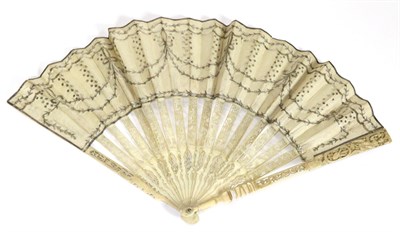 Lot 62 - An Elegant 18th Century Fan, the monture of carved and pierced ivory, the cream double layered...