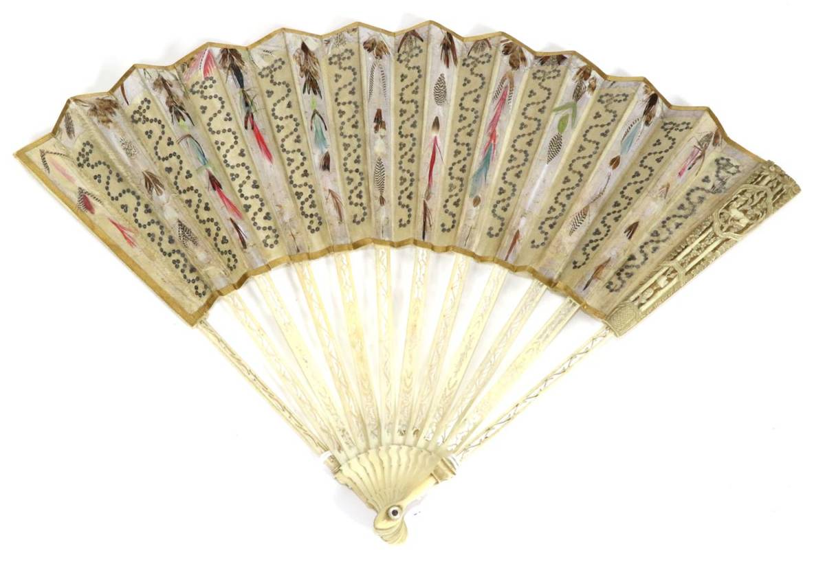 Lot 64 - A Simple 18th Century Ivory Fan, the upper guards quite formally carved and pierced, a lozenge near