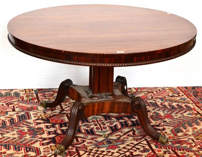 Lot 1065 - A Circular Mahogany Centre Table, circa 1820, the plain frieze with gadrooned moulding above a...