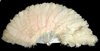 Lot 151 - Frothy Feathers: A Large Circa 1900 Mother-of-Pearl Fan, with slightly frothy white ostrich...