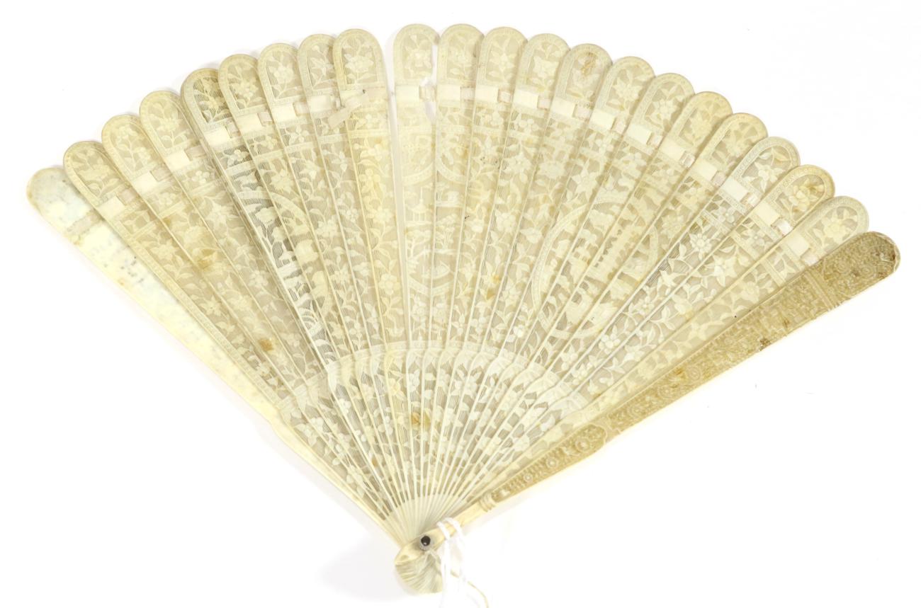 Lot 208 - A Circa 1830's to 1840's Chinese Carved Ivory Brisé Fan, Qing Dynasty, the twenty-two inner sticks