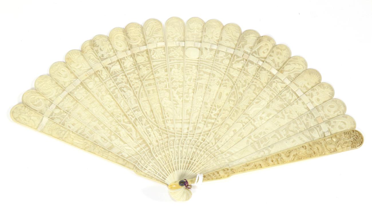 Lot 238 - A Circa 1830's to 1840's Chinese Carved Ivory Brisé Fan, Qing Dynasty, the twenty one inner sticks