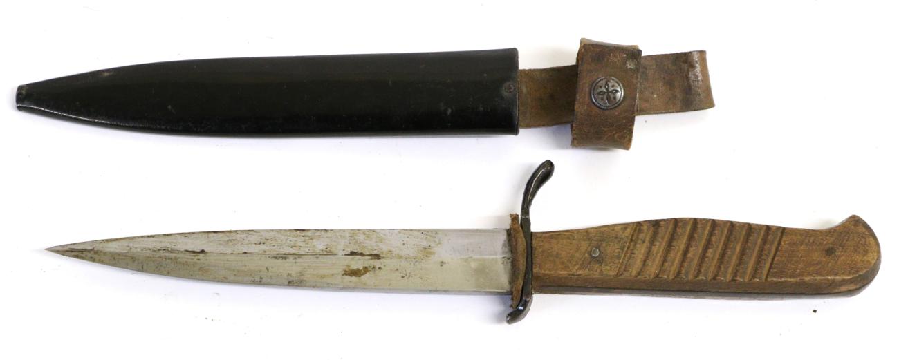 Lot 23 - A Second World War German Trench Knife, with 14cm single edge blade double edged at the tip,...