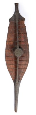 Lot 38 - A 19th Century Nias War Shield, Sumatra, of light Sagow wood reinforced with horizontal bands...