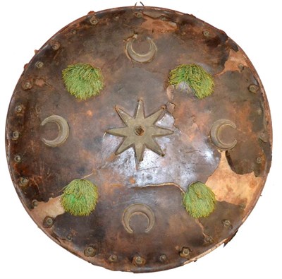 Lot 45 - A Late 19th/20th Century Indian Leather Covered Steel Dhal, of convex circular form, set with a...