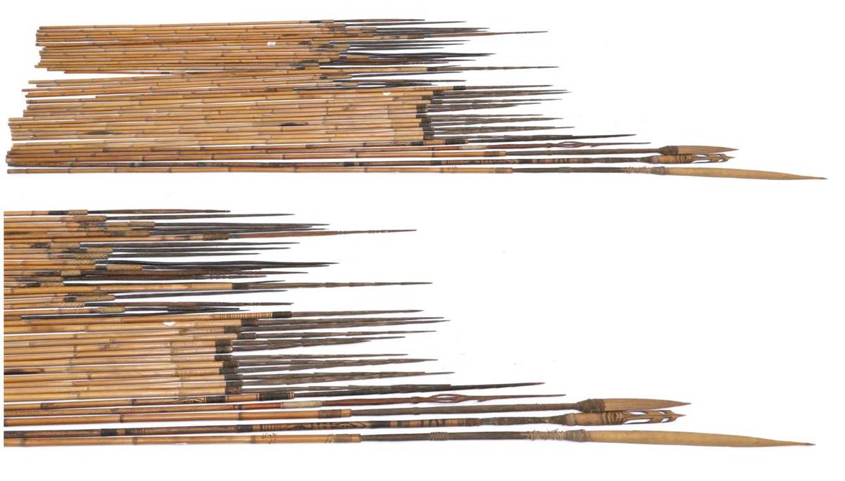 Lot 59 - Three Papua New Guinea Spears, each with a split bamboo head bound to carved palmwood tangs...