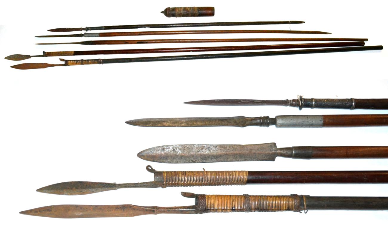 Lot 60 - Two Late 19th Century Indonesian Sumpitans (Blowpipes), each with iron leaf shape blade bound...