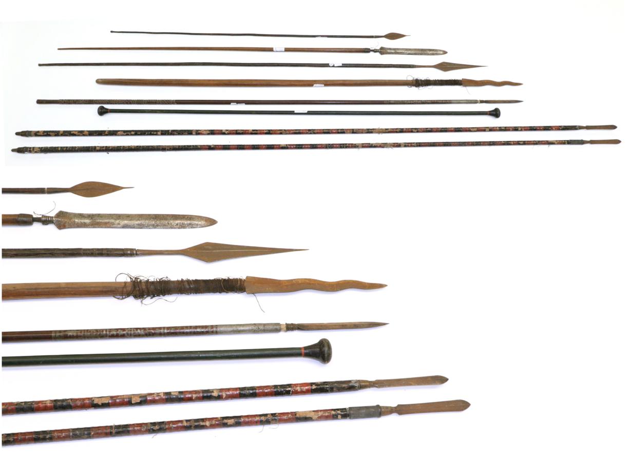 Lot 63 - A Pair of South East Asian Lances, each with slender blade with raised medial ridge, on a...