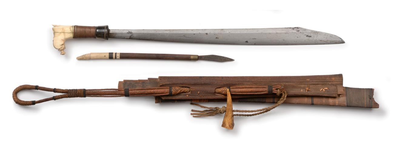 Lot 75 - A Dayak Head Hunter's Sword (Mandau), with 54cm single edge clip point steel blade, with brass...