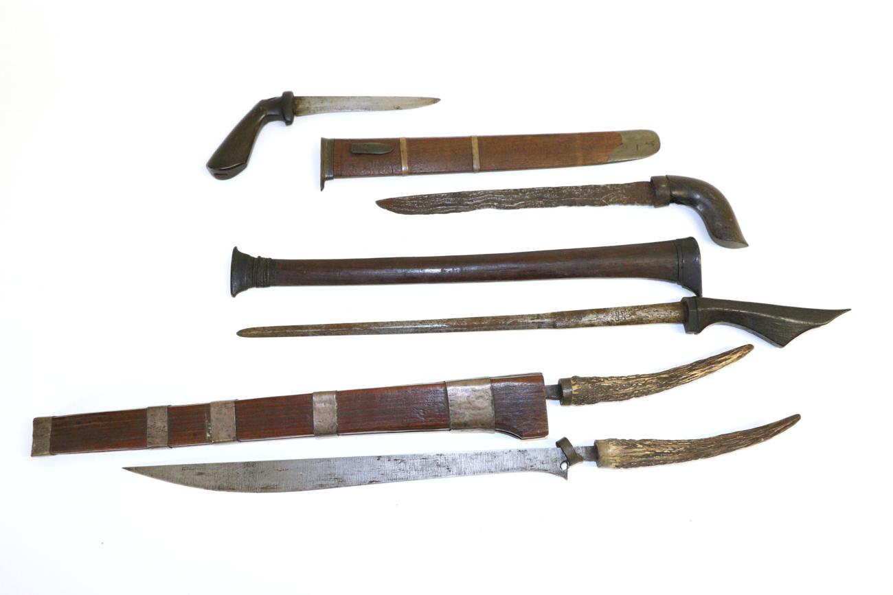 Lot 80 - A 19th Century Batak ";Rawit Pengoekir"; (Double Knife), Sumatra, each knife with 35cm straight...