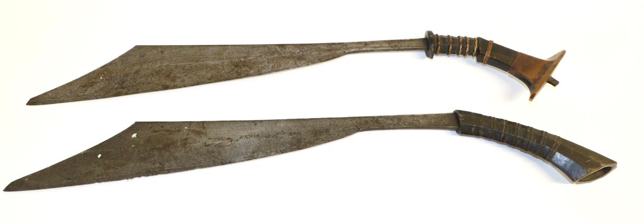 Lot 91 - A 19th Century Moro Panabas, the 60.5cm straight back wide angled blade with clip-point, the...