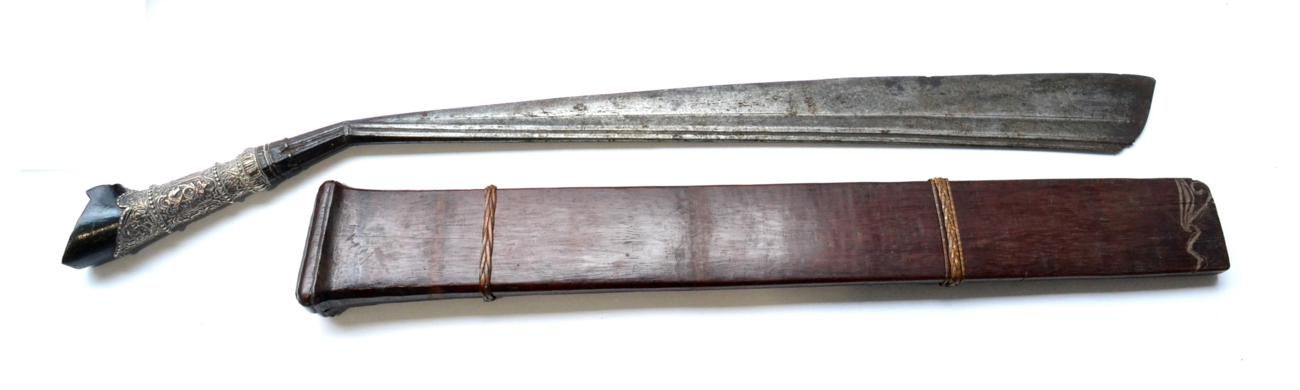 Lot 95 - A 19th Century Parang Latok, Kalimantan, the 48cm heavy steel blade angled at the hilt and widening