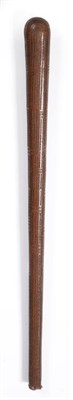 Lot 116 - A 19th Century Fijian Pole Club, of dense hardwood, with rounded tip and small swollen butt,...
