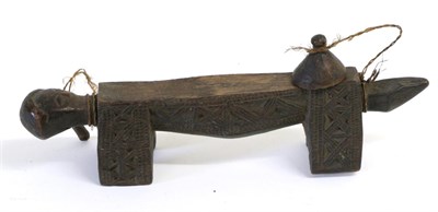 Lot 130 - An Early 20th Century African Anthropomorphic Figure, possibly a headrest, with horizontal...