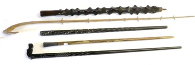 Lot 131 - An African Ebonised Hardwood Walking Stick, the thick haft carved with raised nodules, some...