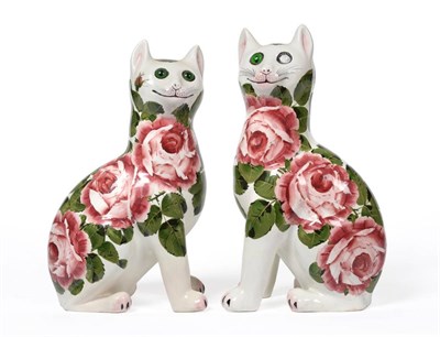 Lot 17 - A Near Pair of Wemyss Pottery Cats, circa 1910, each seated with glass eyes, painted with pink...