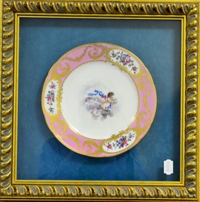 Lot 30 - A Sèvres Style Porcelain Plate, in 18th century style, painted with a cherub amongst clouds...