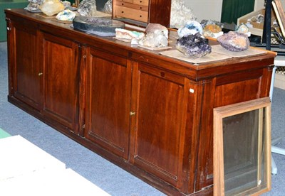 Lot 3053 - A Mahogany Four Door Collectors Cabinet, oak lined drawers having sliding glass covers probably...