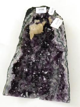 Lot 3198 - An Amethyst Cave With Calcite, Brazil, 33cm high