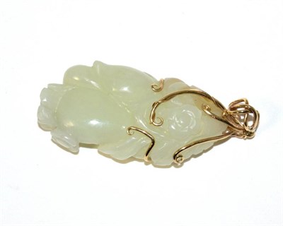 Lot 1 - A Chinese Jade Carving, naturalistically modelled with fruit and flowers, 5.5cm high, mounted...