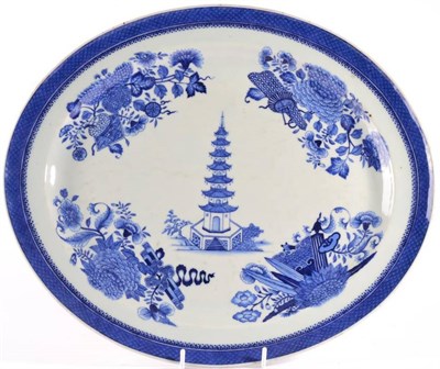 Lot 11 - A Chinese Porcelain Oval Platter, Jiaqing, painted in underglaze blue with a seven storey...