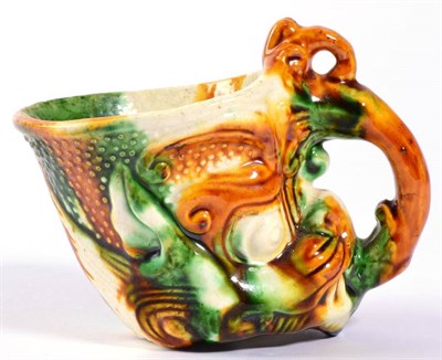 Lot 31 - A Chinese Sancai Glazed Pottery Libation Cup, in Ming style, modelled as the head of a mythical...