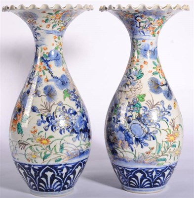 Lot 59 - A Pair of Imari Porcelain Vases, circa 1900, of baluster form with frilled necks, typically painted