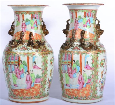 Lot 60 - A Pair of Cantonese Porcelain Baluster Vases, 19th century, with mythical beast handles,...
