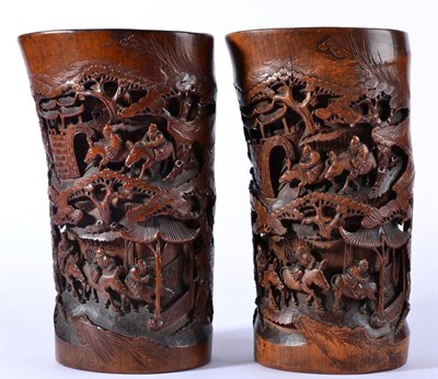 Lot 82 - A Pair of Chinese Bamboo Brush Pots, 19th century, carved in relief with travellers in...