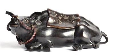 Lot 93 - A Japanese Bronze Model of a Water Buffalo, Meiji period, the recumbent animal with nose ring...